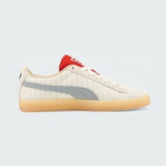 View of the outsole of the Puma Suede x Coca-Cola Unisex white trainers, inside of the shoes and pattern