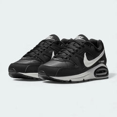 Angled view of two Nike Air Max Command Women's black trainers, side by side, showcasing their classic aesthetic and cushioned design.