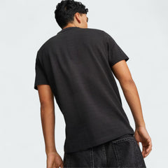 Puma Ferrari Style Jacquard Polo Men's in black, rear model image showing short sleeves, classic fit, and subtle jacquard texture.