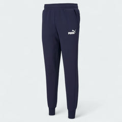 Puma Essential Logo Pants Men's in navy fleece, front view showing the elastic waistband, drawcord, and a white Puma Cat Logo on the thigh.