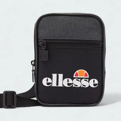 Ellesse Templeton Crossbody Bag in black, front view showing the main zip compartment, front zip pocket, and the Ellesse logo.