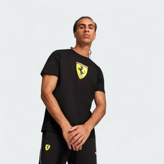 Puma x Ferrari Race Big Shield T-Shirt Men's in black, front view shown on a model showing a classic crew neck and a large, bold Ferrari Scudetto badge on the chest.