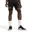 Puma x Ferrari Race Shorts Men's in black model worn, front view showing the elastic waistband, drawcord, and embroidered Ferrari and Puma logos.