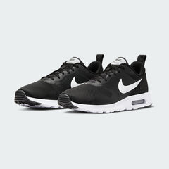 Angled view of two Nike Air Max Tavas Men's black trainers, side by side, showcasing their modern aesthetic and lightweight construction.