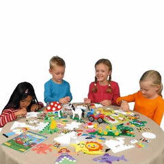 Children playing with toys at a table on a white background