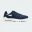 Highlights the high-velocity sweep of the clean white Nike Swoosh, showing the professional sublimated gradient lines across the navy mesh and the clear depth of the heel Air window.