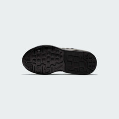 View of the outsole of the Nike Air Max Invigor Children's black trainers, showing the durable rubber tread pattern.