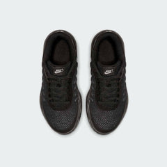 Top-down view of a pair of Nike Air Max Invigor Children's trainers in black, highlighting their streamlined design and lace-up closure.