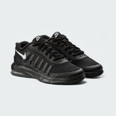 Black athletic shoes with Nike logo on a light gray background