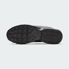 View of the outsole of the Nike Air Max Invigor Men's black trainers, showing the durable rubber tread pattern.