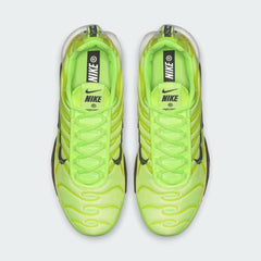Top-down view of a pair of Nike Air Max Plus Men's "Lime Blast" trainers, highlighting the bold lime accents and lace-up closure.