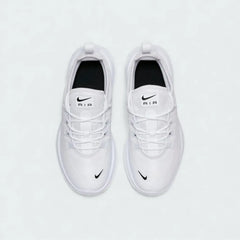 Top-Down view of a pair of Nike Air Max Axis Children's trainers in white and black, highlighting their sleek silhouette and lace-up closure.