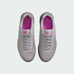 Top-down view of a pair of Nike Air Max Invigor Print Girls' trainers in black, highlighting their streamlined design and lace-up closure.