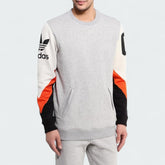 Adidas Crew Basketball Sweatshirt in grey fleece, front view showing ribbed crewneck, cuffs, and hem, with a subtle Adidas logo.