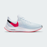 Nike Zoom Winflo 6 Women's running trainers in blue with red and black accents, side profile showing mesh upper, Zoom Air cushioning, and Nike Swoosh.