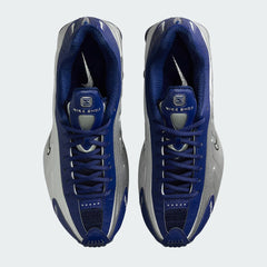 Top-down view of a pair of Nike Shox R4 women's trainers in blue, highlighting their classic silhouette and lace-up closure.