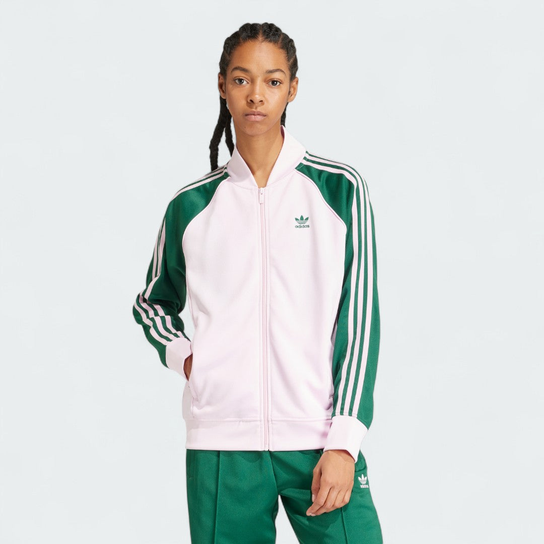 Adidas Adicolor Classics Loose Superstar Track Jacket Women's in clear pink, front view showing the loose fit, full zip, ribbed bomber collar, and embroidered Trefoil logo.