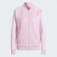 Adidas Adicolor Classics Superstar Track Jacket in orchid fusion pink, front view showing full zip, stand-up collar, white 3-Stripes on sleeves, and embroidered Trefoil logo.