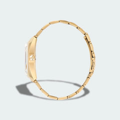 Adidas Edition One Watch in gold metallic, side profile showing the thickness of the case and the links of the stainless steel bracelet.