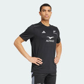 Main profile of the All Black jersey, highlighting the sleek short-sleeve construction and the iconic silver 3-Stripes on the shoulders.