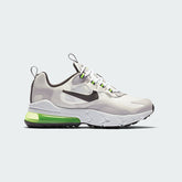 Nike Air Max 270 Juniors' trainers in summit white with silver and lilac accents, side profile showing prominent 270-degree visible Max Air unit and mesh upper.
