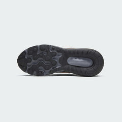 View of the outsole of the Nike Air Max 270 React Winter Juniors' black trainers, showing the durable rubber tread pattern for reliable traction.