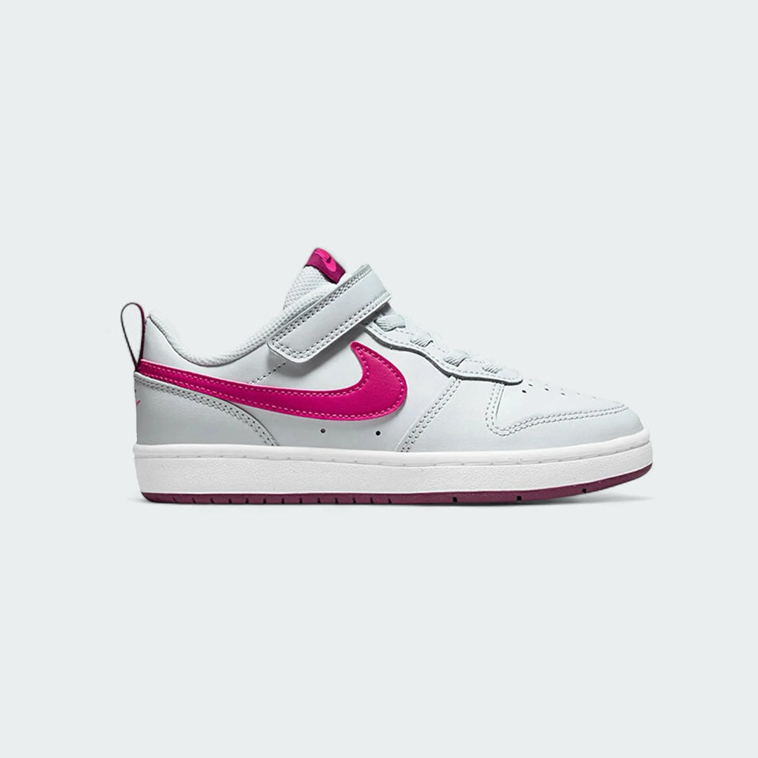 Nike Court Borough Low 2 Girls' trainers in pure platinum (off-white) with pink prime accents, side profile showing classic leather upper and a pink Nike Swoosh.