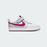 Nike Court Borough Low 2 Girls' trainers in pure platinum (off-white) with pink prime accents, side profile showing classic leather upper and a pink Nike Swoosh.