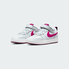 Angled view of two Nike Court Borough Low 2 Girls' trainers in off-white and pink, side by side, showcasing their timeless design and classic athletic aesthetic.