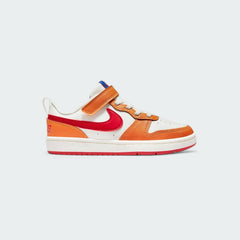 Nike Court Borough Low 2 children's trainers in sail (off-white) with red, orange, and blue accents, side profile showing classic design and Nike Swoosh.