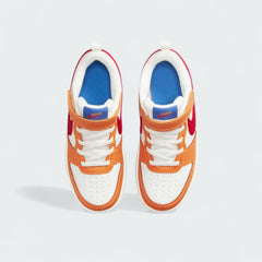 Top-down view of a pair of Nike Court Borough Low 2 children's trainers in sail, highlighting the laces/hook-and-loop closure and retro style.