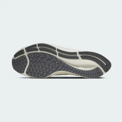 View of the outsole of the Nike Air Zoom Pegasus 37 Men's grey running trainers, showing the durable rubber waffle-inspired tread pattern for road traction.