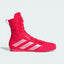 Side profile of the Lucid Red Adidas Box Hog, showing the mid-cut silhouette and the Zero Metallic silver Three Stripes.