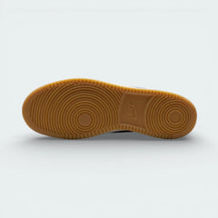 View of the rubber outsole, showcasing the classic pivot-circle traction pattern in a durable navy finish.