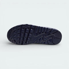 View of the rubber outsole, showcasing the legendary waffle traction pattern and the flex grooves in the forefoot.