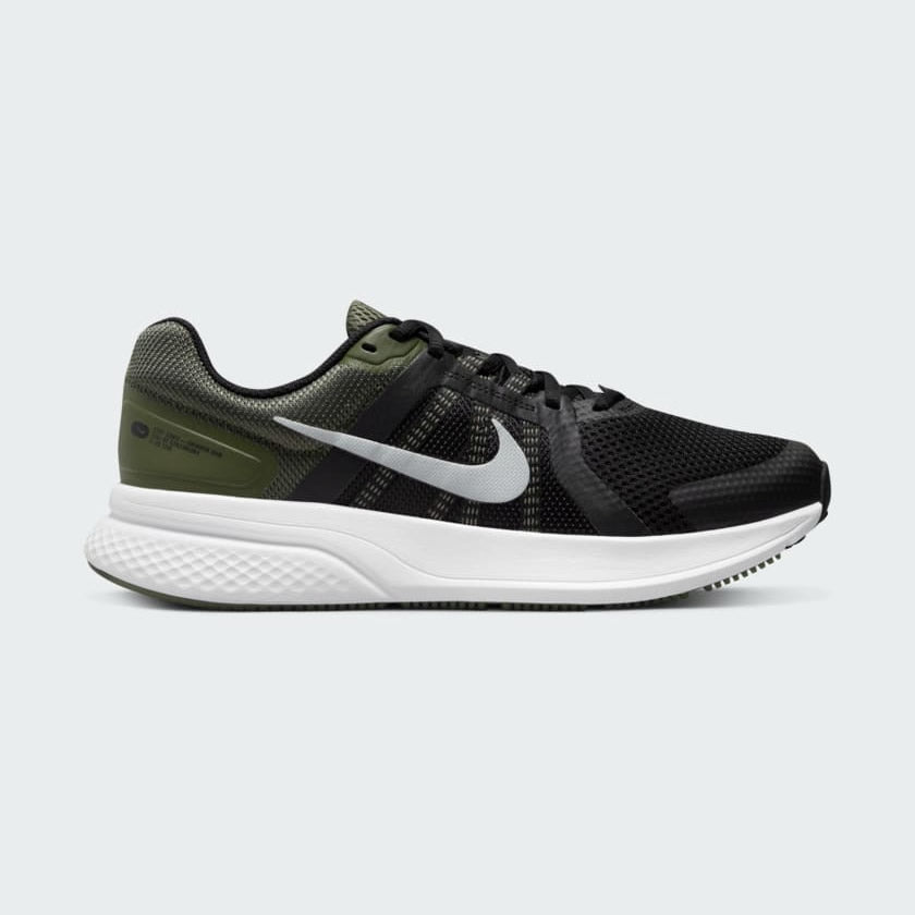 Nike Run Swift 2 Men's running shoes in black with white accents, side profile showing breathable mesh upper, foam midsole, and Nike Swoosh.