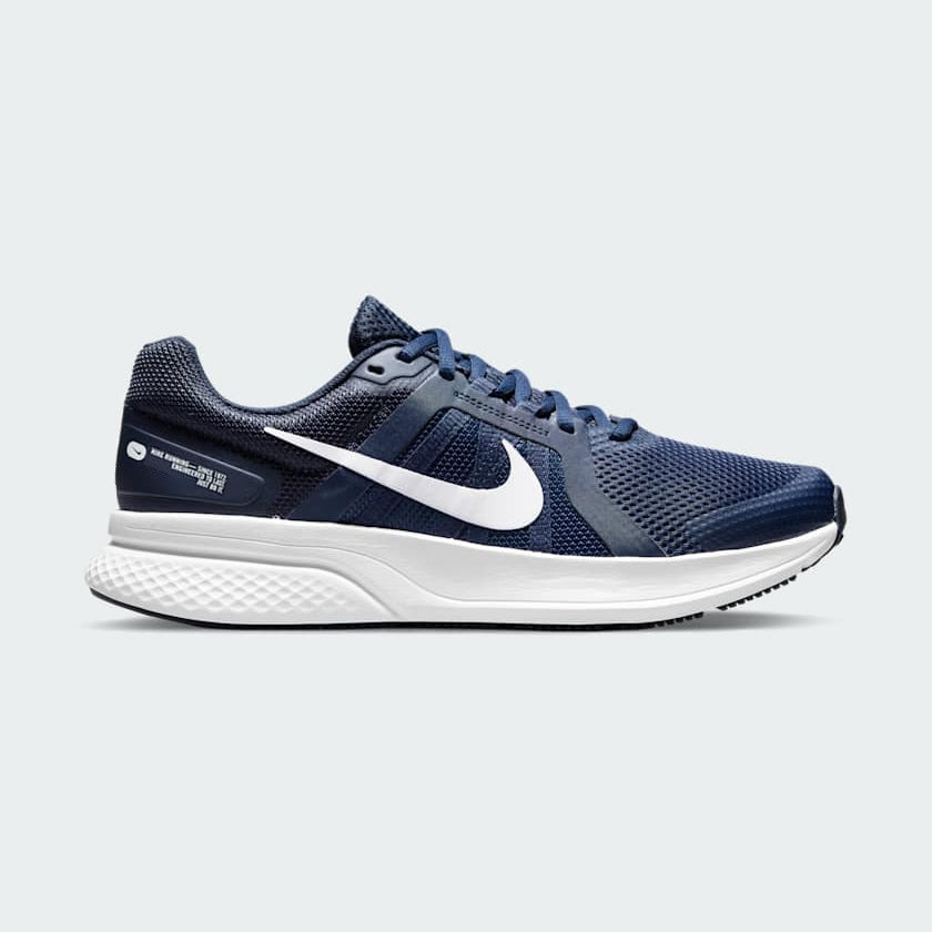 Nike Run Swift 2 Men's running shoes in midnight navy blue with white accents, side profile showing breathable mesh upper, foam midsole, and Nike Swoosh.