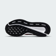 View of the outsole of the Nike Run Swift 2 Women's pink running shoes, showing the durable rubber tread pattern for road traction.