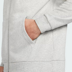 Detailed zoom on the full-zip hardware and the ribbed hem, highlighting the durable sustainable material.