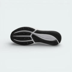 View of the black rubber outsole, showcasing the signature molded star traction pattern and flexible grooves.