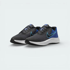 Angled shot of both Nike Star Runner 3 trainers, showcasing the sleek aerodynamic silhouette and the bold blue highlights.