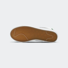 View of the outsole of the Nike Blazer Mid '77 Juniors' white trainers, showing the durable rubber sole with herringbone traction pattern.