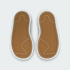View of the outsole of the Nike Court Legacy Toddlers' black shoes, showing the durable rubber tread pattern for traction.