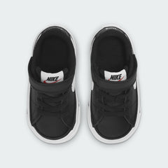 Top-down view of a pair of Nike Court Legacy Toddlers' shoes in black, highlighting their sleek silhouette and easy-entry closure.