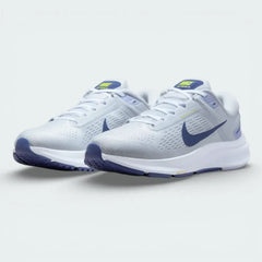 Angled shot of both Nike Air Zoom Structure 24 trainers side by side, showcasing the clean platinum aesthetic and soft blue accents.