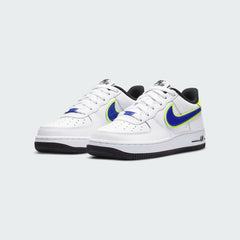 Angled view of two Nike Air Force 1 '07 Juniors' trainers in white with racer blue and volt accents, side by side, showcasing their timeless design and clean aesthetic.