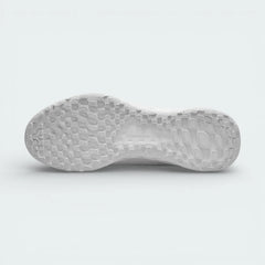 Detailed view of the white rubber outsole, showing the generative traction pattern and flex grooves designed for a natural stride.