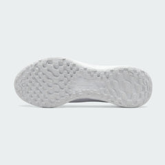 View of the outsole of the Nike Revolution 6 Women's white training shoes, showing the durable rubber tread pattern with flex grooves for traction.