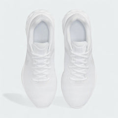 Top-down view of a pair of Nike Revolution 6 Women's training shoes in white, highlighting their streamlined silhouette and lace-up closure.