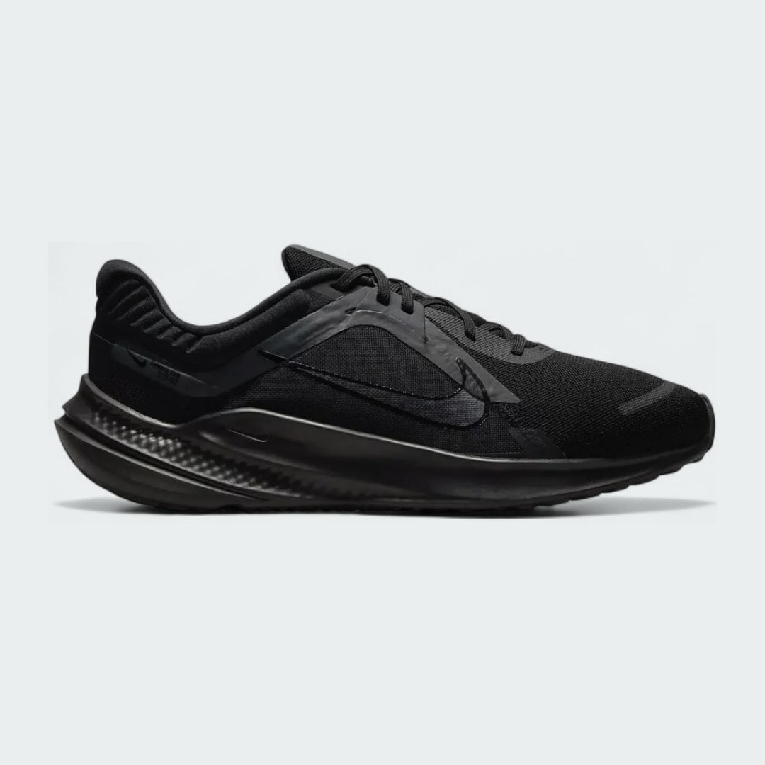 Nike Quest 5 Men's running trainers in black with a black midsole, side profile showing mesh upper, foam cushioning, and Nike Swoosh